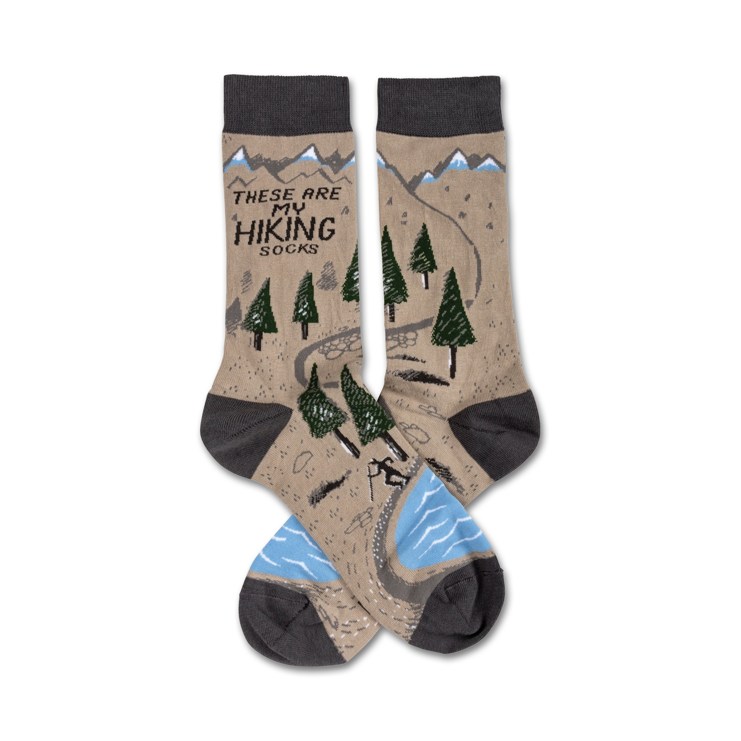 Pair of crew hiking socks. Tan background with a trail, trees, mountains, and a small hiker graphic.  Grey cuffs and light blue water detail.