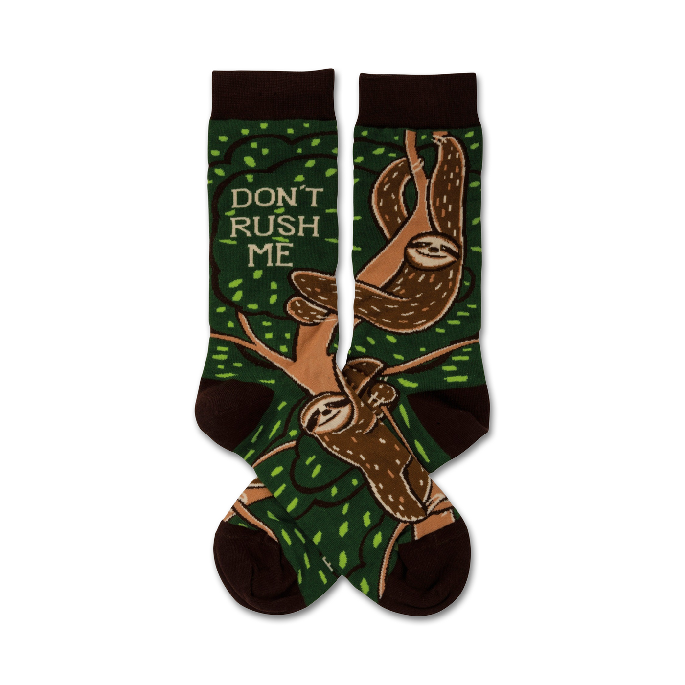 A pair of crew socks with sloths hanging from tree branches on a green background.  The socks are brown and green, and feature the text 'Don't Rush Me'.
