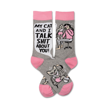 gray crew socks with pink toes and heels featuring a cartoon of a woman and a cat talking with the phrase "my cat and i talk shit about you!"   