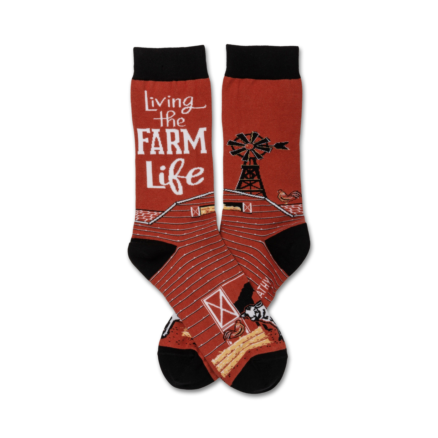 A pair of crew socks in red and black features a barn, windmill, chicken, and cow. The text 'Living the Farm Life' is prominently displayed.