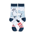 A pair of crew socks in white, blue, and red.  They feature a llama illustration, a mountain scene, and the text 'Drama Llama is no fun, politics'.
