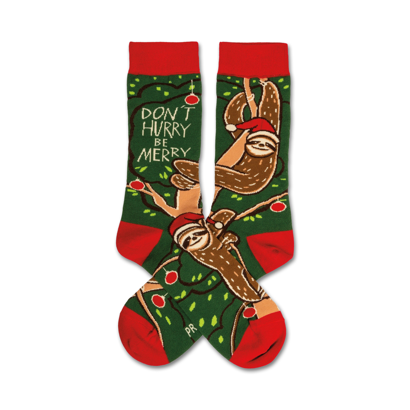 Crew socks in red and green featuring sloths wearing Santa hats on a green background with a 'Don't Hurry, Be Merry' message.