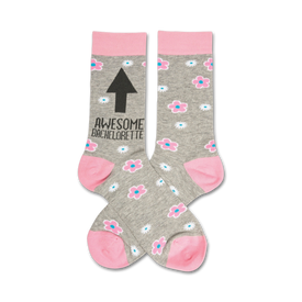 heather grey crew socks with pink cuff, toes and heel with a pattern of flowers and the text awesome bachelorette on the leg with an arrow pointing up