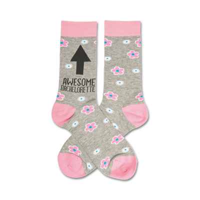 heather grey crew socks with pink cuff, toes and heel with a pattern of flowers and the text awesome bachelorette on the leg with an arrow pointing up