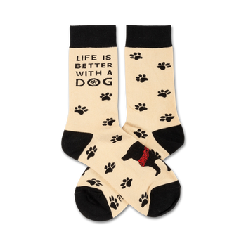 black, tan, and red crew socks featuring dog paw prints, a black dog wearing a red bandana, and the words "life is better with a dog".  