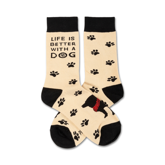 black, tan, and red crew socks featuring dog paw prints, a black dog wearing a red bandana, and the words 