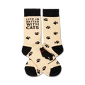 Cream crew socks with black paw prints and a black cat design.  Text reads, 'Life is better with cats'.