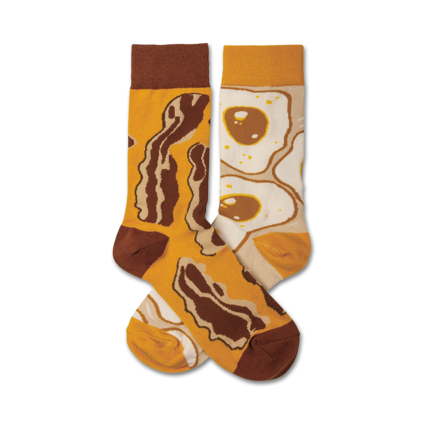A pair of crew socks with a fun breakfast design. One sock features crispy brown bacon, the other shows sunny-side up eggs.  The main colors are mustard yellow and brown.