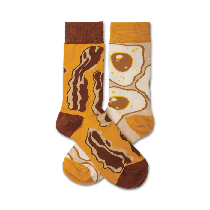 brown bacon and yellow eggs on a white background in a crew length sock for men and women.    }}