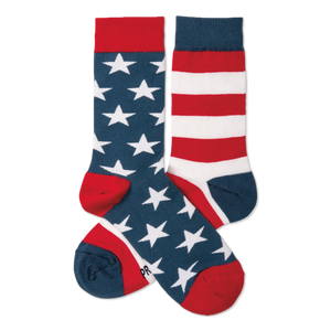 A pair of crew socks. One navy blue with white stars, red cuff/heel/toe. The other red and white stripes, navy cuff/heel/toe.