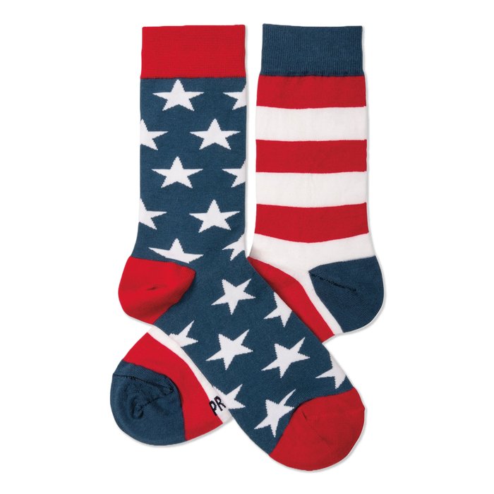 A pair of crew socks. One navy blue with white stars, red cuff/heel/toe. The other red and white stripes, navy cuff/heel/toe.