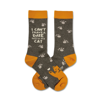 Crew socks in grey and gold.  One sock features the text 'I can't have a date with my cat', the other has paw prints and a small illustration of a cat.