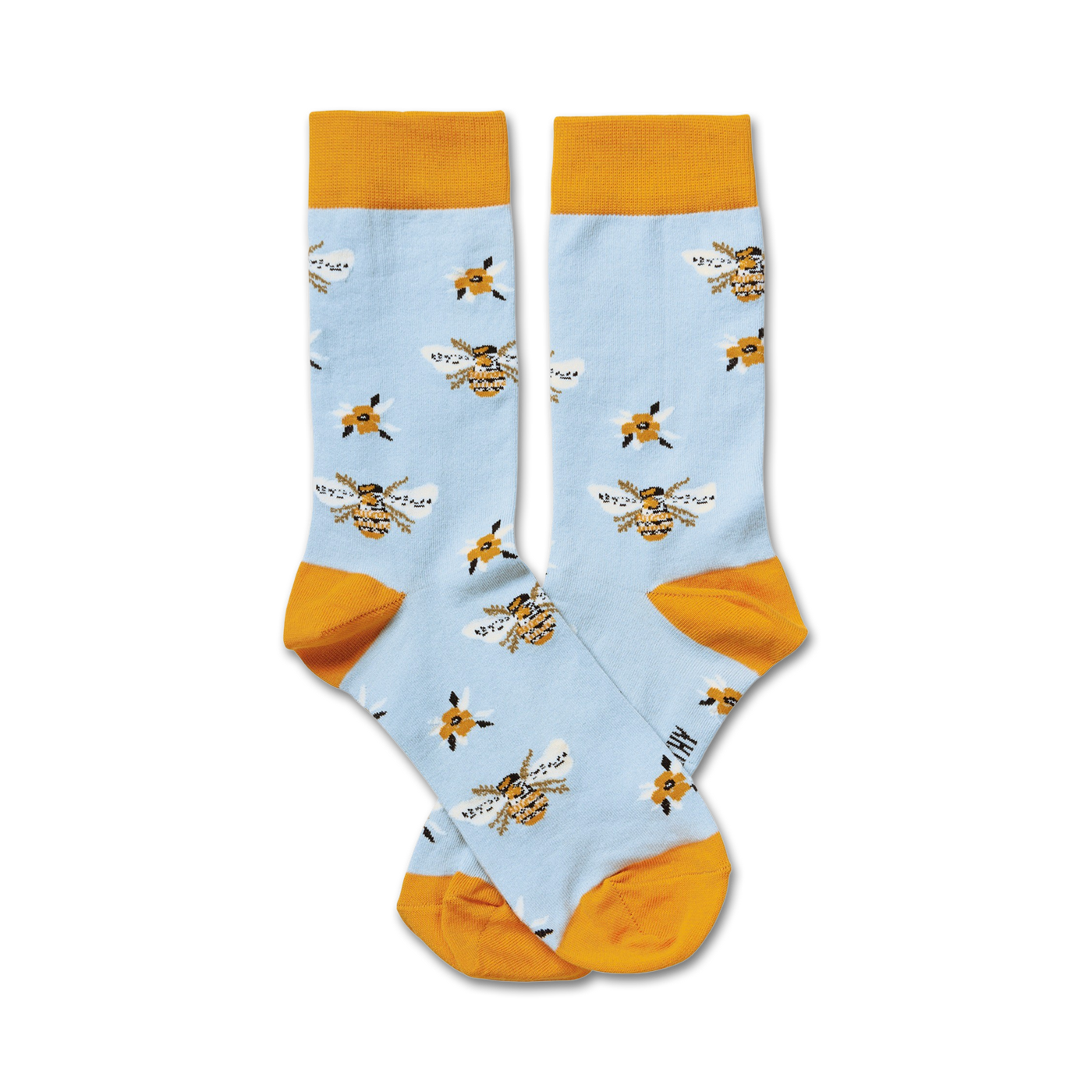 Pair of light blue crew socks with a pattern of yellow bees and small yellow flowers.  The socks have a mustard yellow cuff.