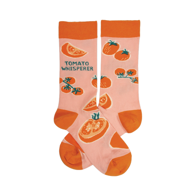 Pair of pink crew socks with an orange tomato pattern and the text 'Tomato Whisperer'.