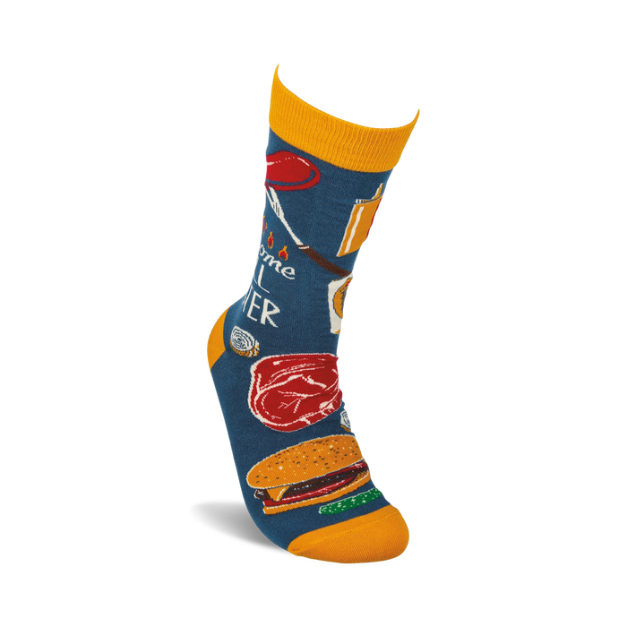 A pair of blue socks with a pattern of grilling items, including a hot dog, a steak, a hamburger, and a grill fork. The socks are labeled 