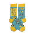 Crew socks in teal and yellow.  Feature funny illustrations of working from home, including a laptop, cat, and sticky notes.