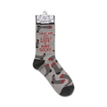 Product shot of a single 'I Don't Give A Shit' sock hanging on a retail display tag.