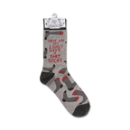 Product shot of a single 'I Don't Give A Shit' sock hanging on a retail display tag.