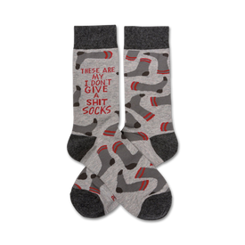 gray socks with red toe, heel, and sole; white text reads, "these are my i don't give a shit socks"; red lines and black and red footprints all over.  