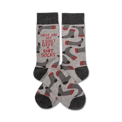 gray socks with red toe, heel, and sole; white text reads, "these are my i don't give a shit socks"; red lines and black and red footprints all over.  