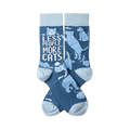 A pair of crew socks in dark blue with light blue heels, toes, and cuffs, featuring various light blue cats and white text.