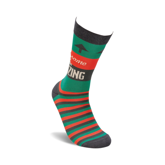 A pair of green socks with red and brown stripes and the words 