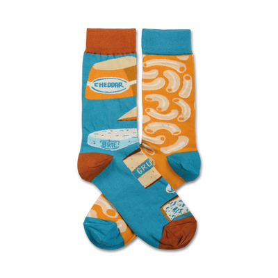 blue crew socks with orange toes and cuffs, featuring a pattern of macaroni and cheese.   