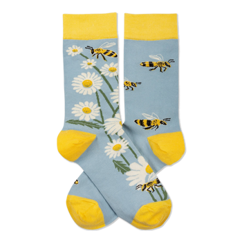 Pair of light blue crew socks with yellow cuffs, heels, toes. One sock has white daisies, the other has yellow and black bees.