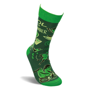 Single molded crew sock with deep green background, bright green accents, and a pattern of animated cucumbers.