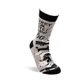 Single grey crew sock with "SORRY I'M LATE! I SAW A DOG" text and dog pattern, worn on a foot with a black stand on a white background.