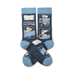 Pair of crew socks in blue and cream featuring illustrations of people sleeping.  The text 'I'd Rather Be Sleeping' is printed on the socks.