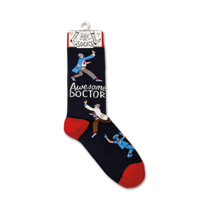 A pair of blue socks with a red toe, heel, and cuff. The socks have a repeating pattern of cartoon doctors in white coats and surgical masks. The socks are packaged on a cardboard display card with a plastic hanger tab. The card has a white background with a red stripe at the top and a blue stripe at the bottom. The words 