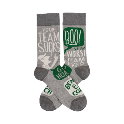 Crew socks in grey with a white and green design. The socks feature phrases like "Your Team Sucks" and a cartoon character.