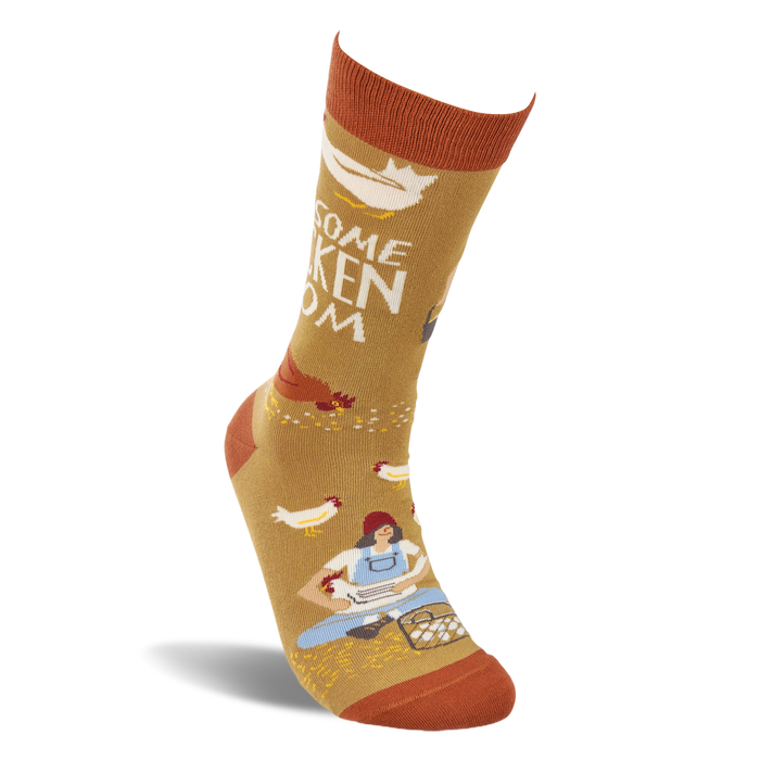 Single mustard yellow crew sock shown standing, with a woman gathering eggs and chickens visible on the design.