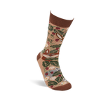 Single tan crew sock standing angled. Features a brown cuff, heel, and toe, with a woodland pattern of fox, leaves, berries, mushrooms, and "I'D RATHER BE IN NATURE" text.