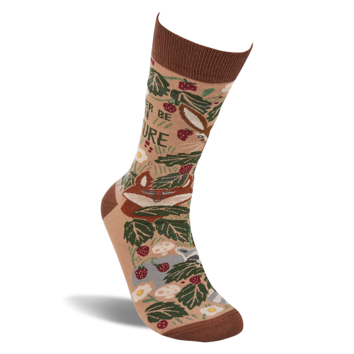 Single tan crew sock standing angled. Features a brown cuff, heel, and toe, with a woodland pattern of fox, leaves, berries, mushrooms, and 