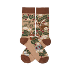 Two tan nature-themed crew socks crossed, showing a fox, rabbit, green leaves, red berries, mushrooms, and "I'D RATHER BE IN NATURE" text.