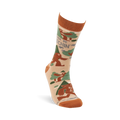 Single beige crew sock with rust orange cuff, heel, and toe. It features brown Sasquatch, green trees, and "I'd Rather Be Squatchin'" text.