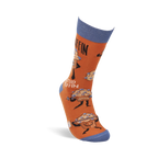 Single orange crew sock standing upright, with blue cuff, heel, and toe, showing "Studmuffin" text and cartoon muffins.
