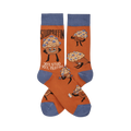 Pair of orange crew socks with blue cuffs, heels, and toes, featuring cartoon "Studmuffin" characters in various strong poses.