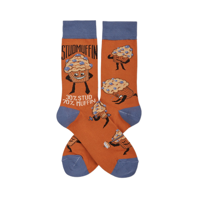 Pair of orange crew socks with blue cuffs, heels, and toes, featuring cartoon "Studmuffin" characters in various strong poses.