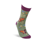 A single olive green crew sock, angled, showing a skeleton butterfly wearing sunglasses and "SOCIAL BUTTERFLY" text.