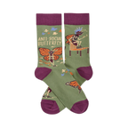 Olive green crew socks with dark purple accents. Design features skeleton butterflies in sunglasses and mohawks, plus "ANTI SOCIAL BUTTERFLY" text.