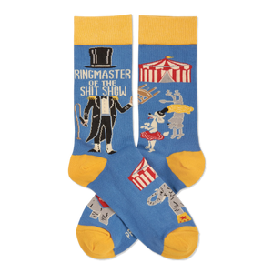 Pair of blue crew socks with yellow accents. Features a ringmaster, text 