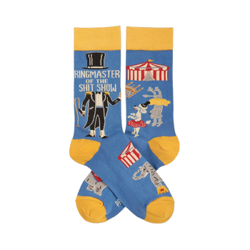Pair of blue crew socks with yellow accents. Features a ringmaster, text "Ringmaster Of The Shitshow", and circus animals.