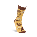 A single yellowish-tan crew sock, standing upright, with brown cowboy boots, white flowers, and the quote "FORGET GLASS SLIPPERS THIS PRINCESS WEARS BOOTS!" clearly visible.