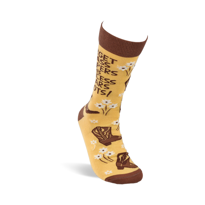 A single yellowish-tan crew sock, standing upright, with brown cowboy boots, white flowers, and the quote 