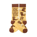 Pair of yellowish-tan crew socks with brown cuffs, heels, and toes. They feature brown cowboy boots, white flowers, and the quote "FORGET GLASS SLIPPERS THIS PRINCESS WEARS BOOTS!" visible on one sock.
