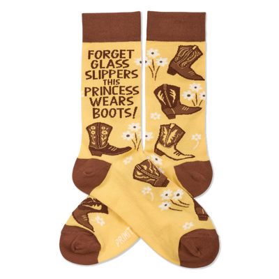 Pair of yellowish-tan crew socks with brown cuffs, heels, and toes. They feature brown cowboy boots, white flowers, and the quote "FORGET GLASS SLIPPERS THIS PRINCESS WEARS BOOTS!" visible on one sock.