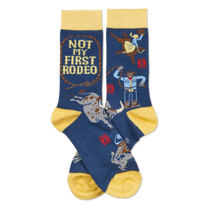 Pair of dark blue crew socks with yellow cuffs, heels, and toes. Design includes cowboys, bulls, and 